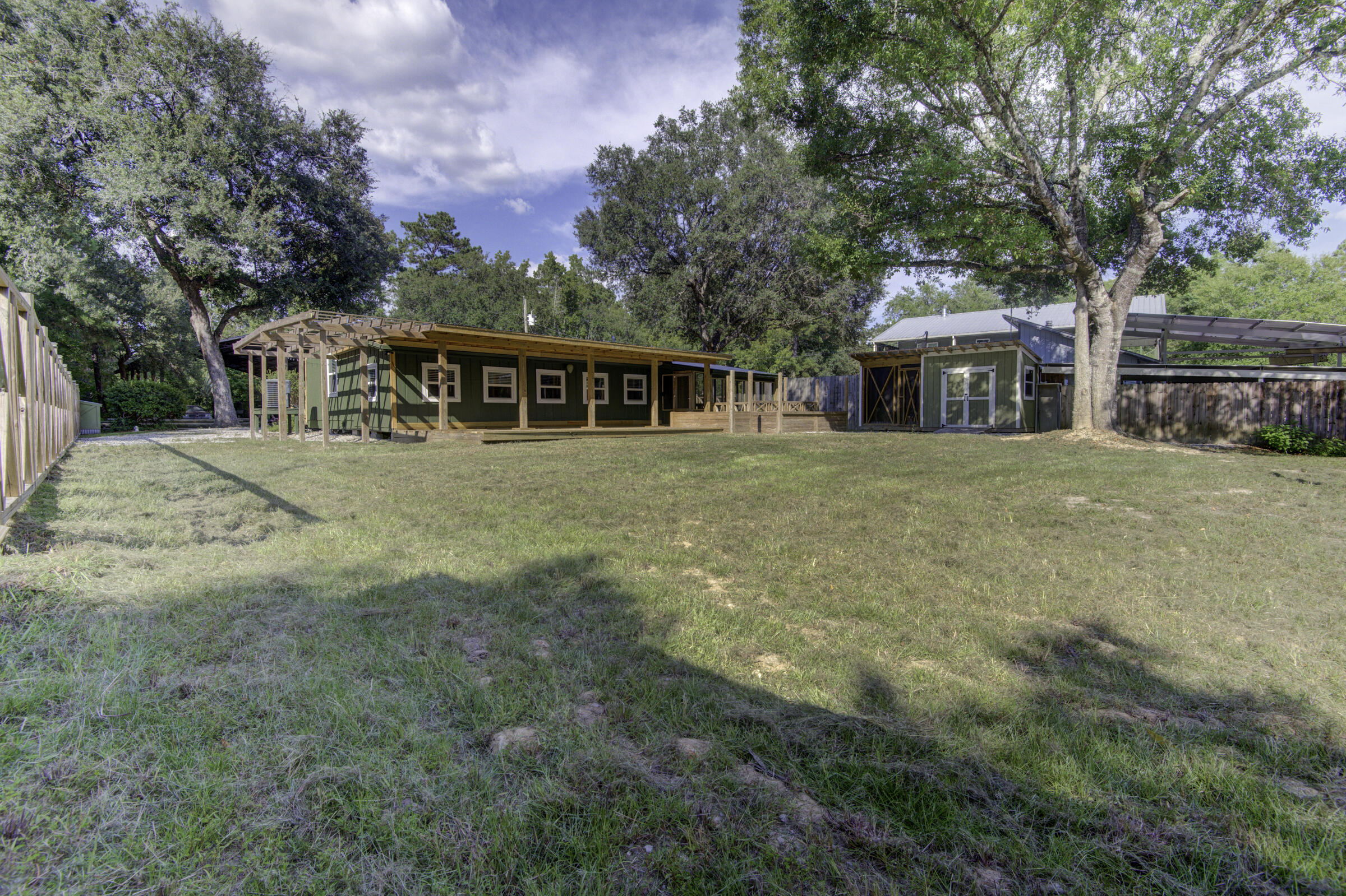 85 Our Street Vernon, FL 32462 - Photo 32 of 66 a front view of house with yard and trees