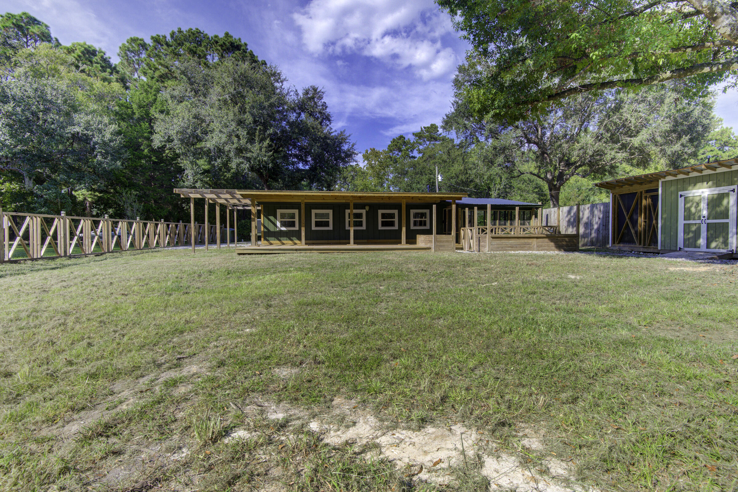 85 Our Street Vernon, FL 32462 - Photo 33 of 66 front view of a house with a yard and trees