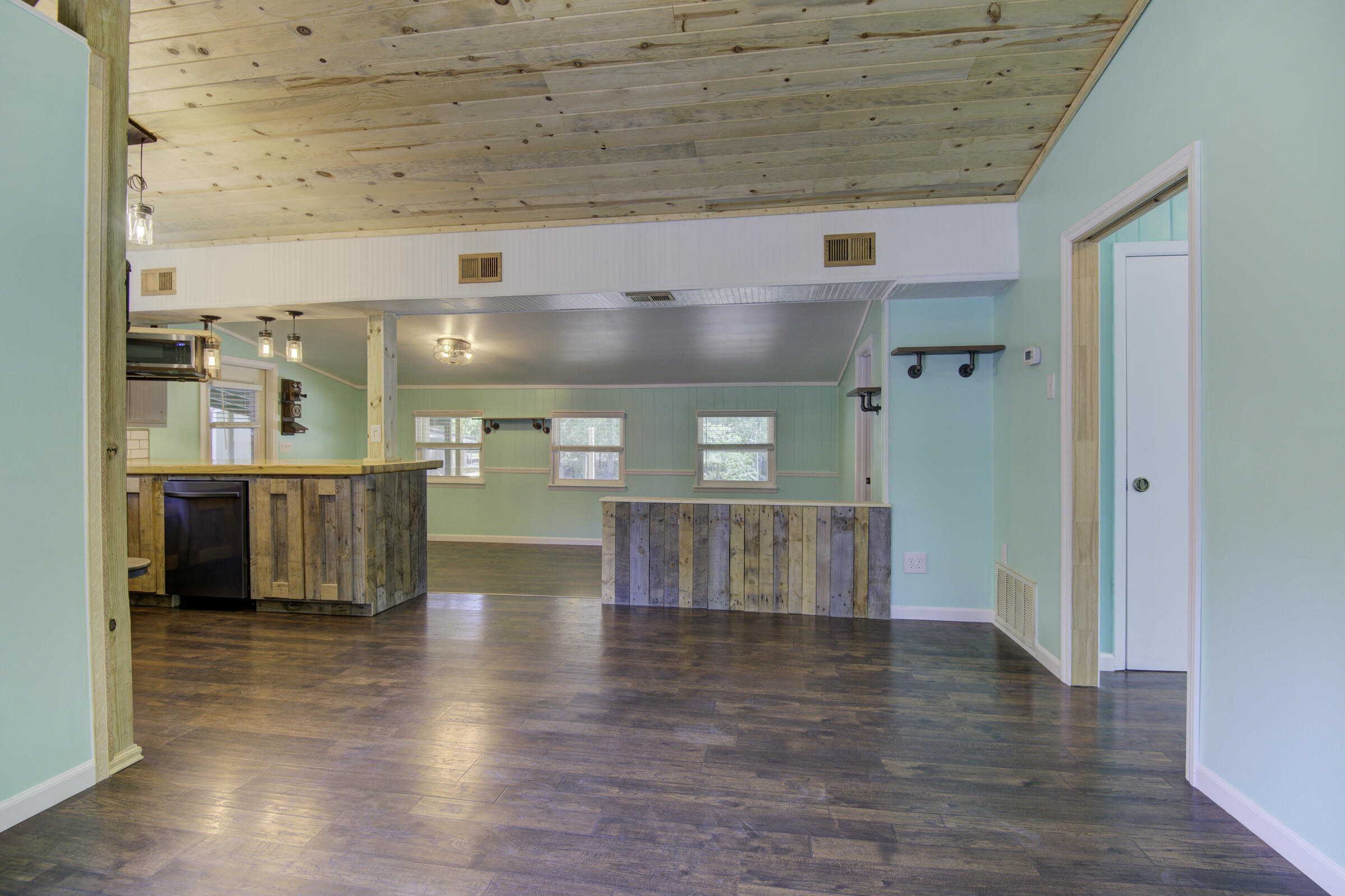 85 Our Street Vernon, FL 32462 - Photo 34 of 66 a view of kitchen with furniture and wooden floor