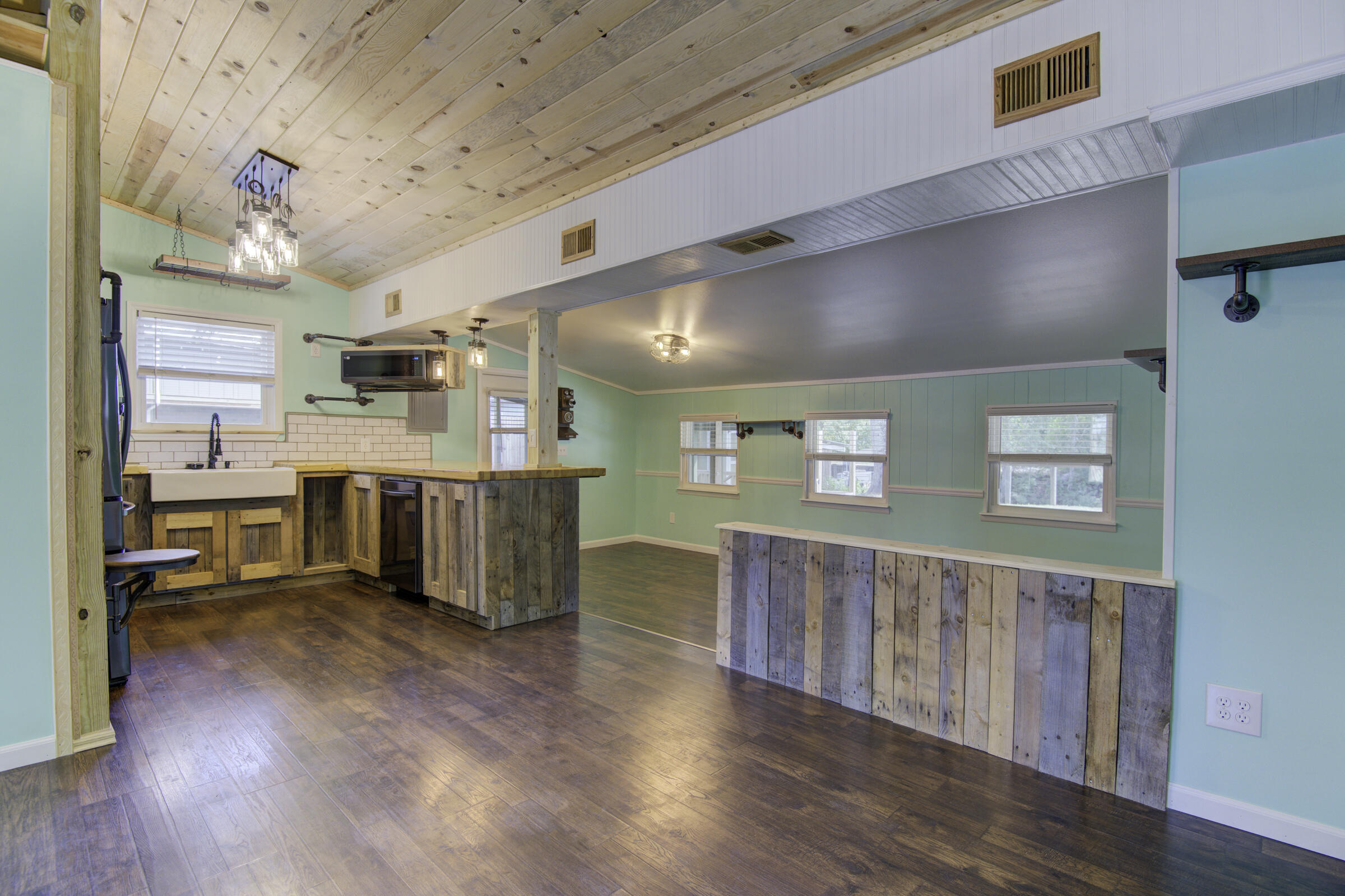 85 Our Street Vernon, FL 32462 - Photo 35 of 66 a view of a kitchen with furniture and wooden floor