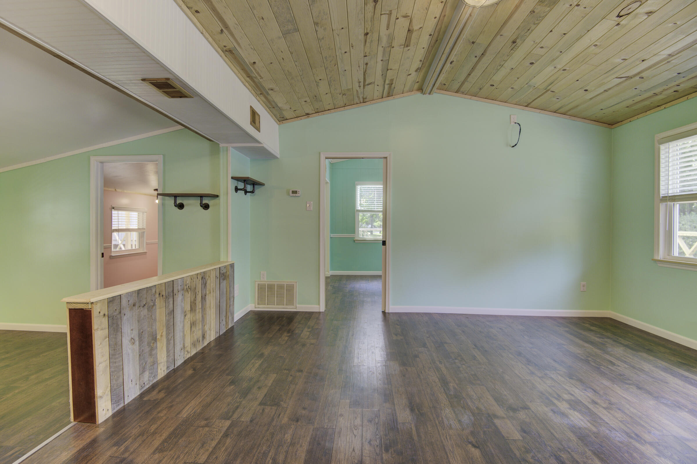 85 Our Street Vernon, FL 32462 - Photo 36 of 66 a view of a hallway with wooden floor