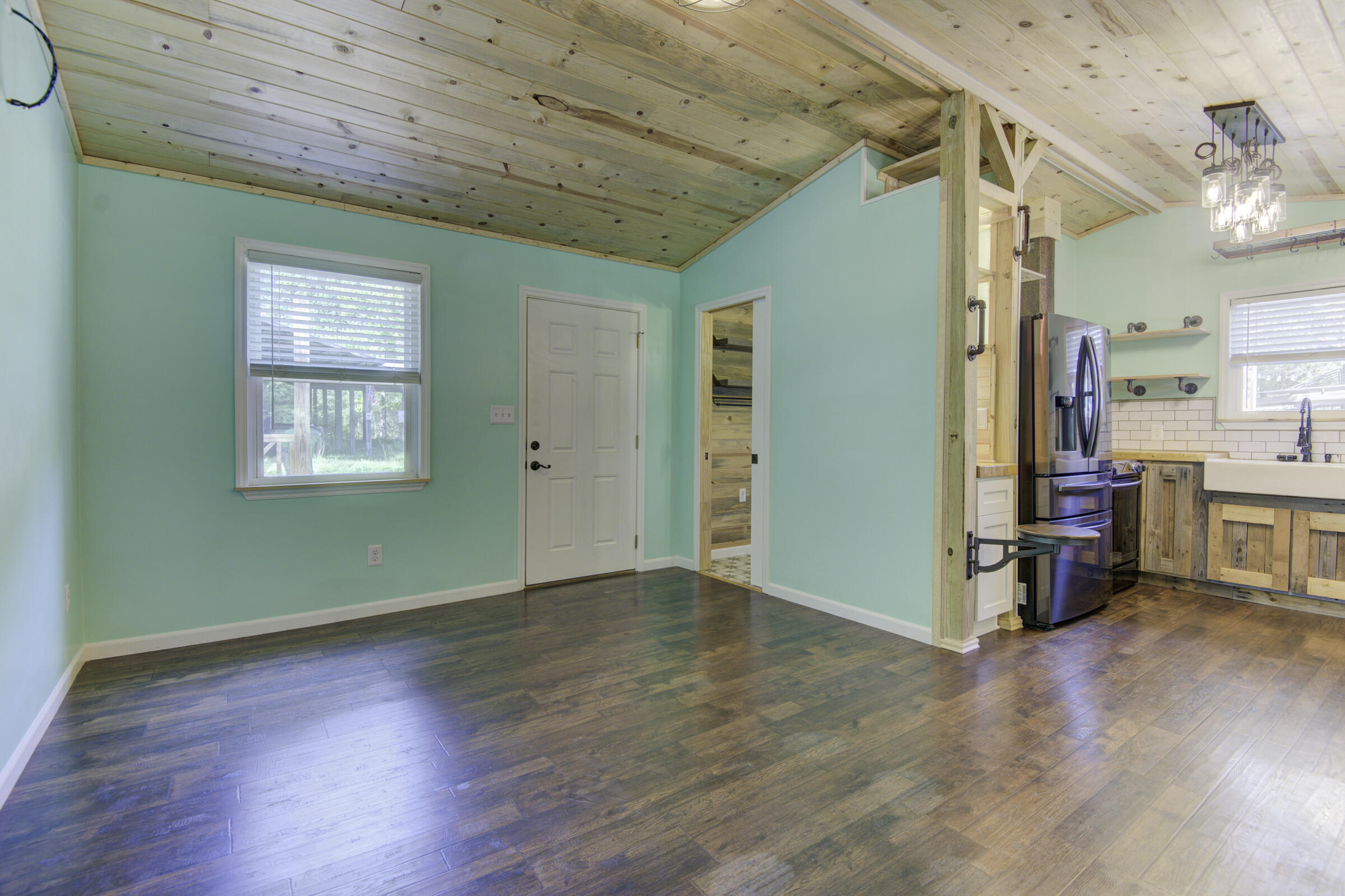 85 Our Street Vernon, FL 32462 - Photo 38 of 66 an empty room with wooden floor and windows