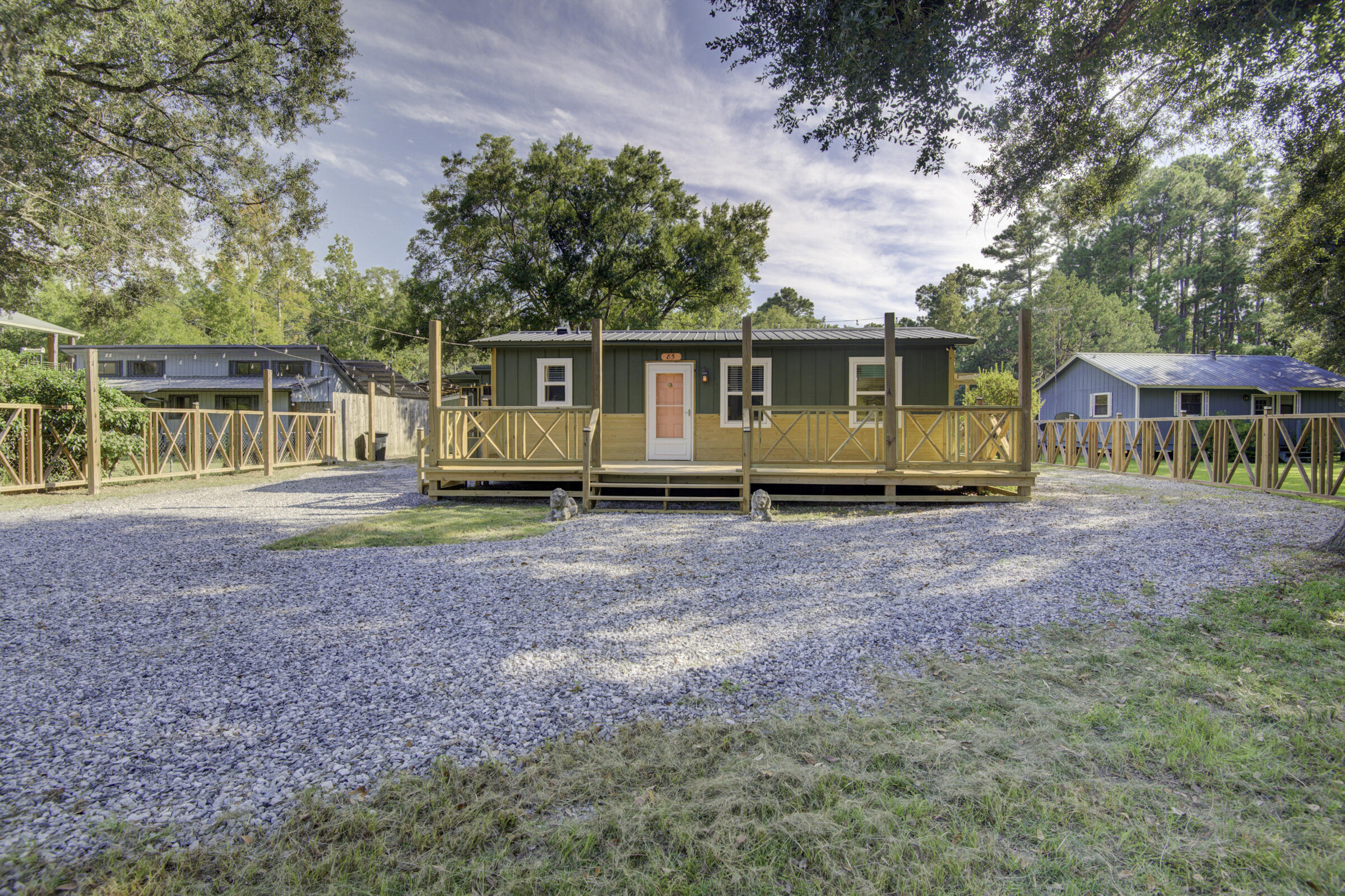85 Our Street Vernon, FL 32462 - Photo 4 of 66 a front view of a house with garden