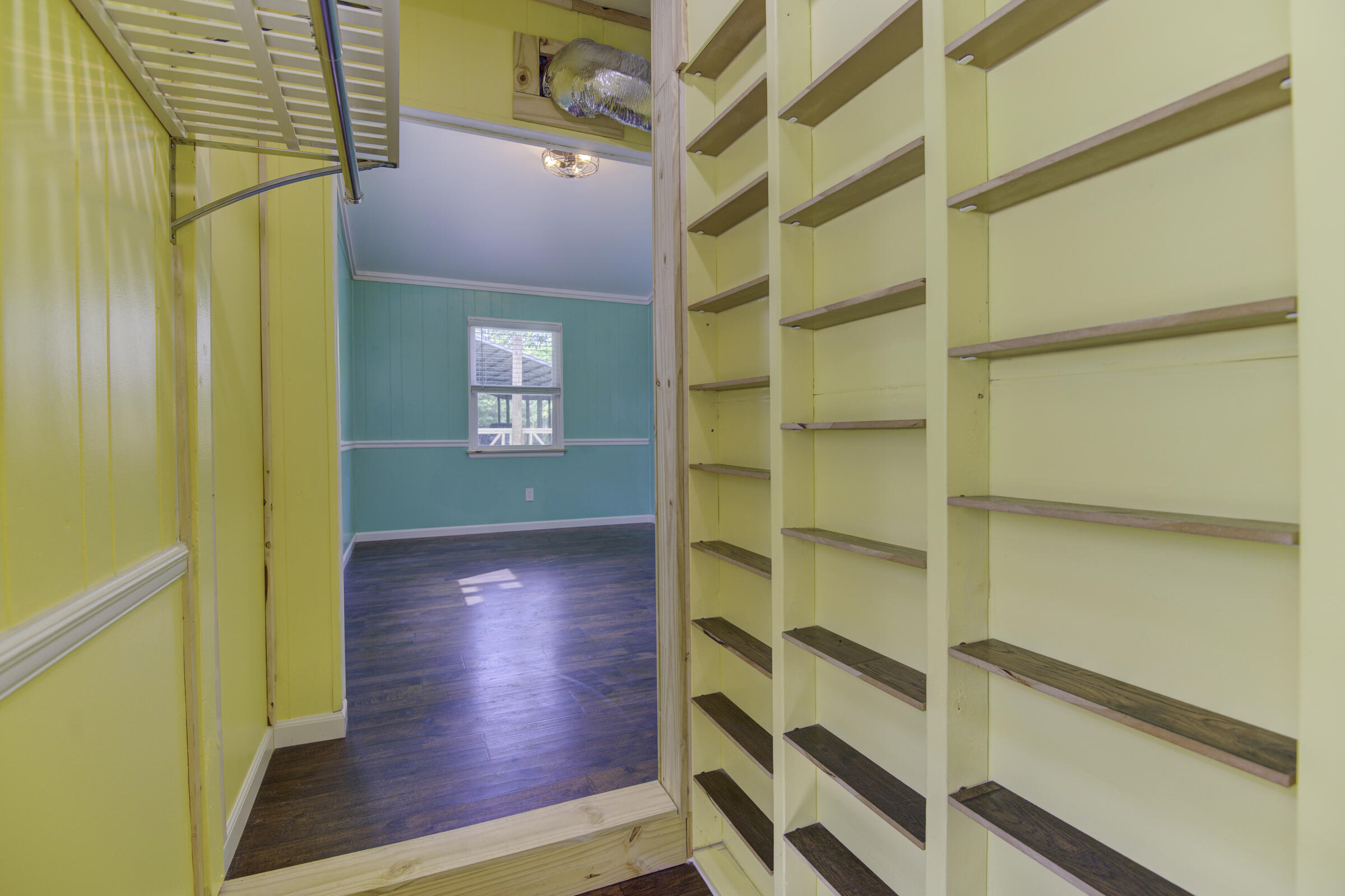85 Our Street Vernon, FL 32462 - Photo 61 of 66 a view of a hallway with wooden floor and a cabinet