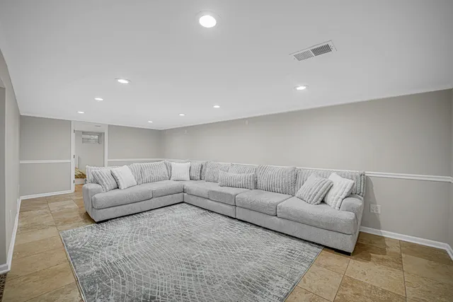 a living room with furniture and a couch