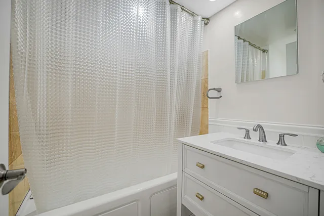 a bathroom with a sink a vanity and a mirror