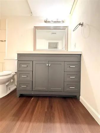 a view of a vanity and mirror