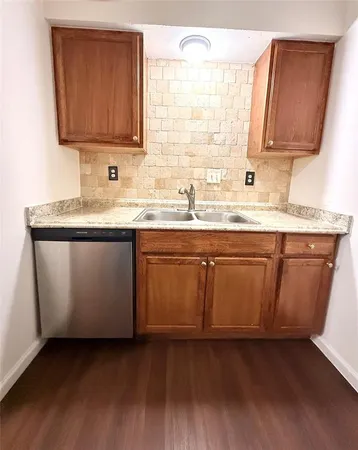 a kitchen with a sink and cabinets