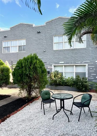 a house view with a seating space and garden