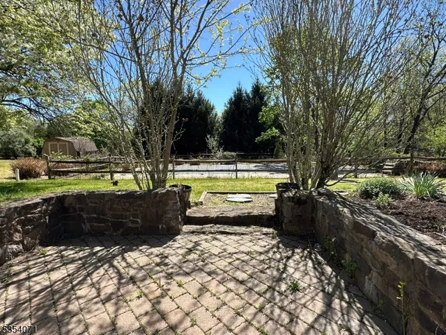 a view of a swimming pool with an outdoor seating