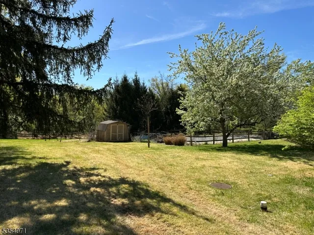 a swimming pool with trees in the background