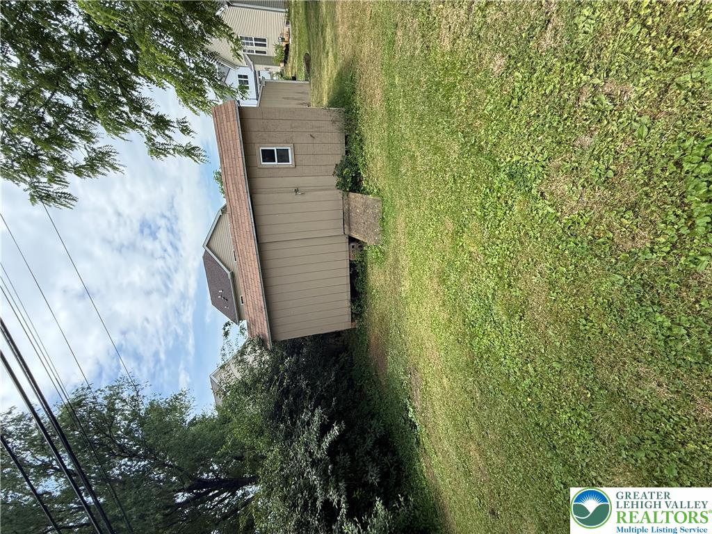 1150 Ridge Avenue Allentown, PA 18102 - Photo 14 of 14 A private backyard oasis with ample green space and a convenient storage shed.