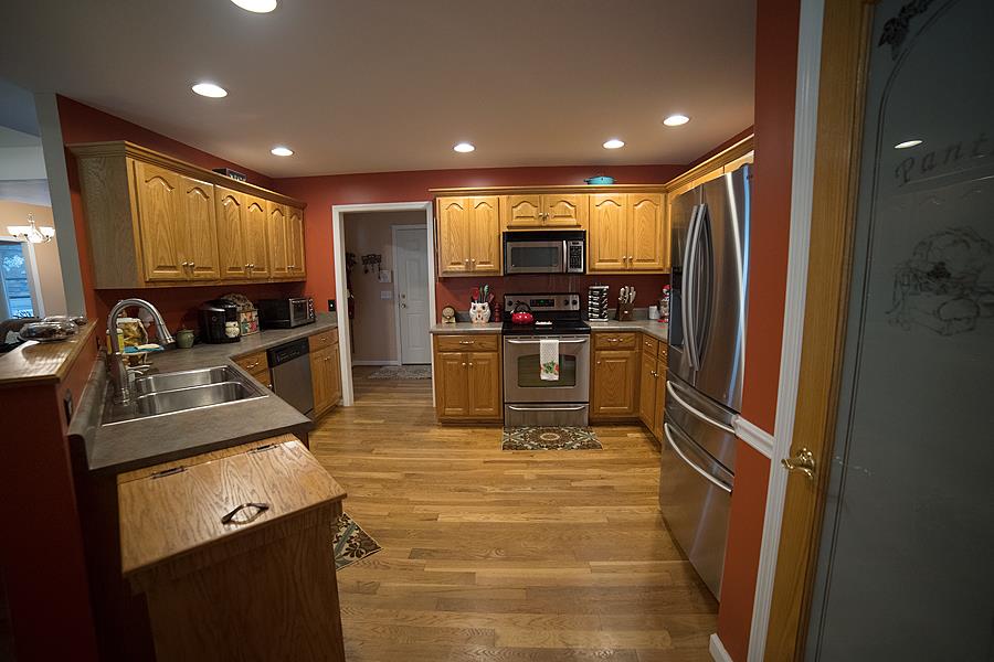 597 Mortons Lake Road Manchester, TN 37355 - Photo 7 of 16 Another view of the kitchen shows off the counter space and cabinets and the pretty Pantry door.