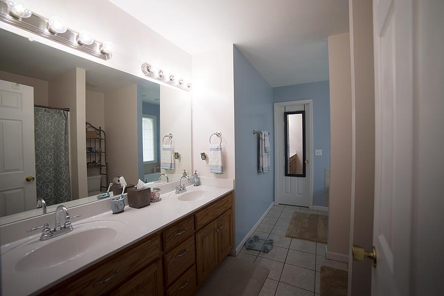 597 Mortons Lake Road Manchester, TN 37355 - Photo 9 of 16 Luxury Owners Bath with double vanity, separate shower, and whirlpool tub.