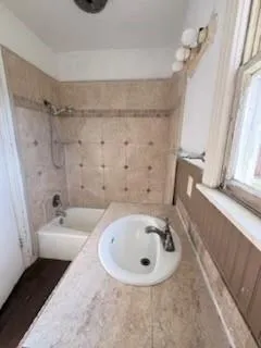 a bathroom with a sink and a tub