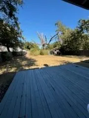 a view of an ocean beach and yard