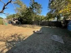 a view of backyard with green space