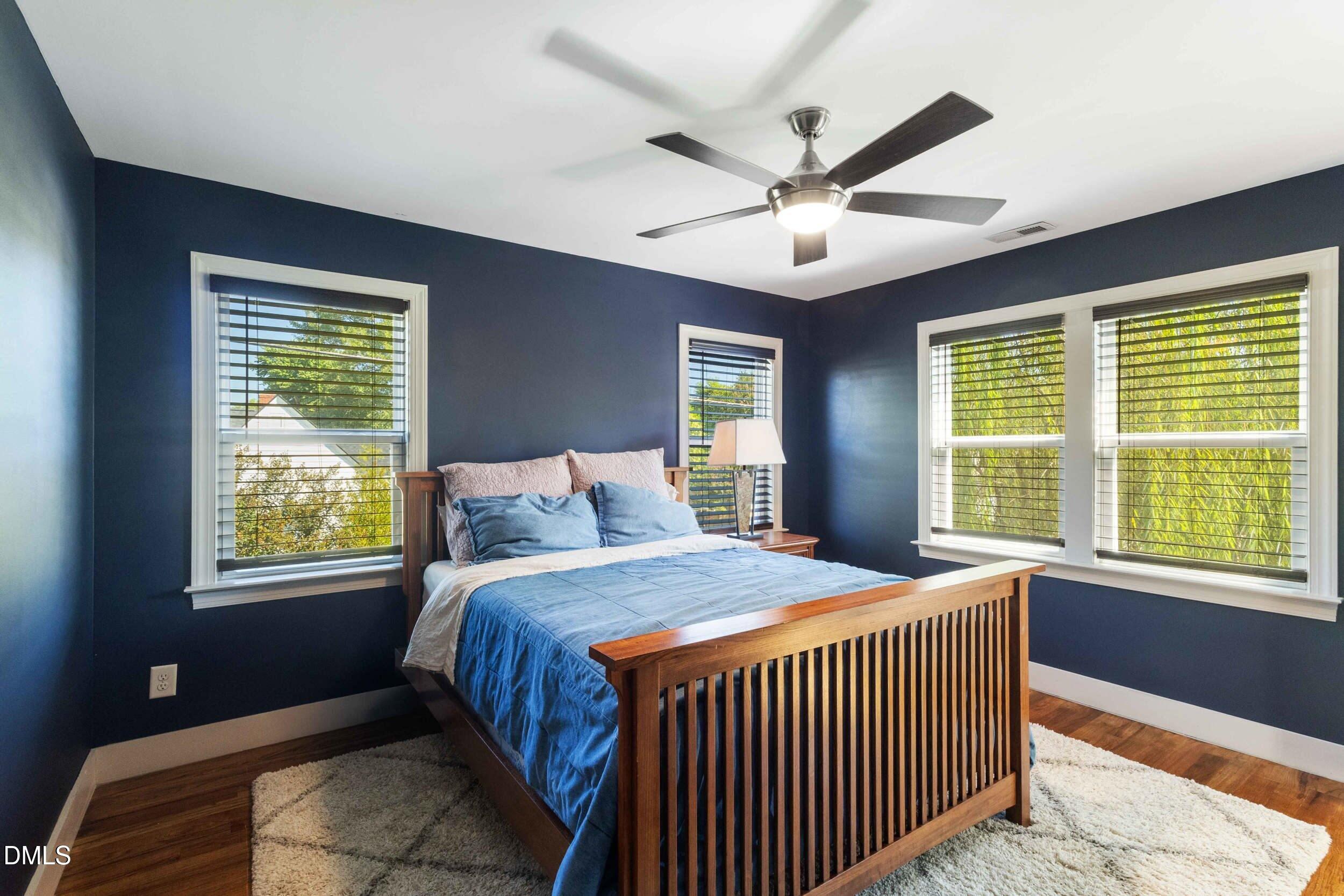 200 Lincoln Court Raleigh, NC 27610 - Photo 20 of 45 a bedroom with a large bed and a window
