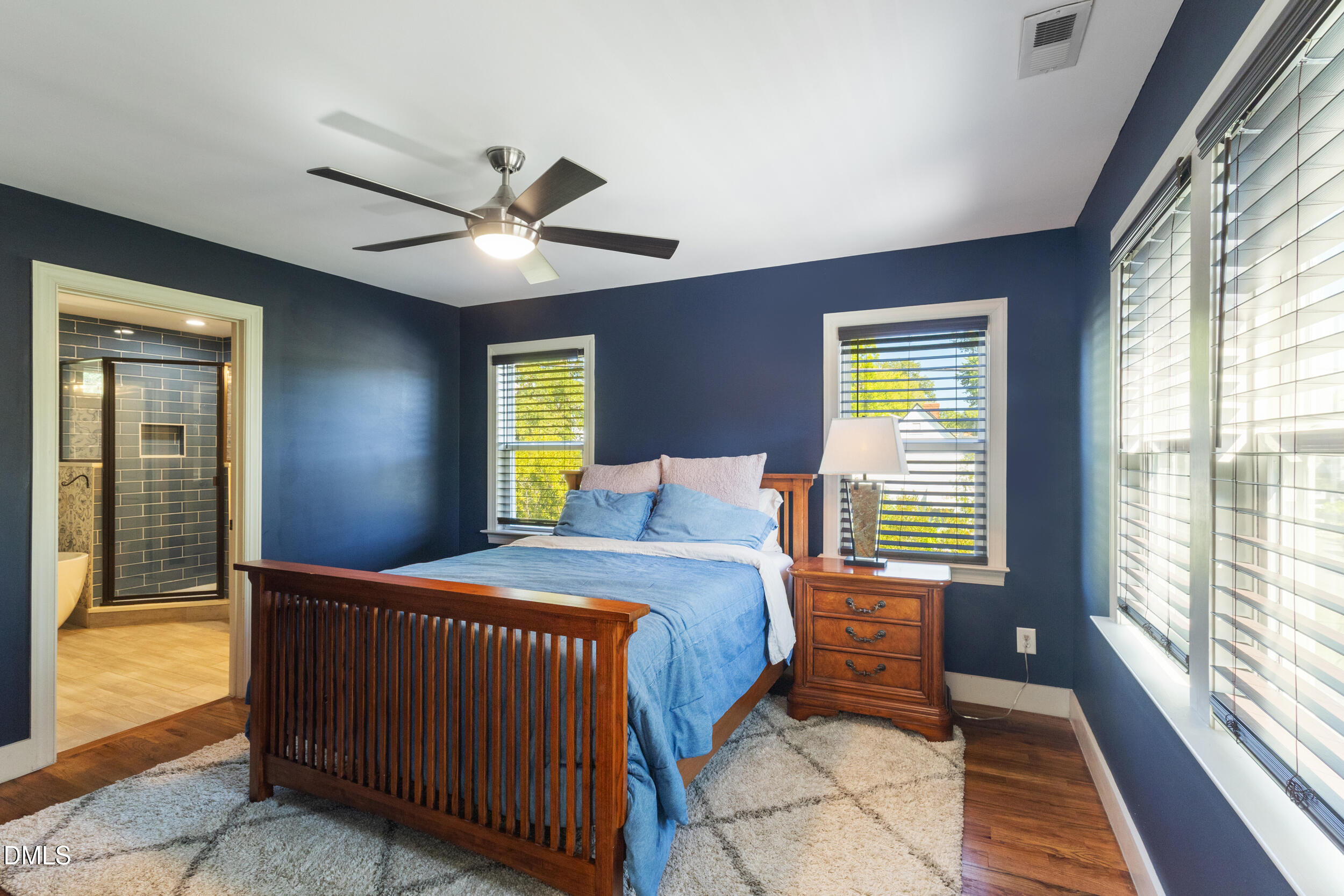 200 Lincoln Court Raleigh, NC 27610 - Photo 21 of 45 a bedroom with a bed and a large window with balcony view