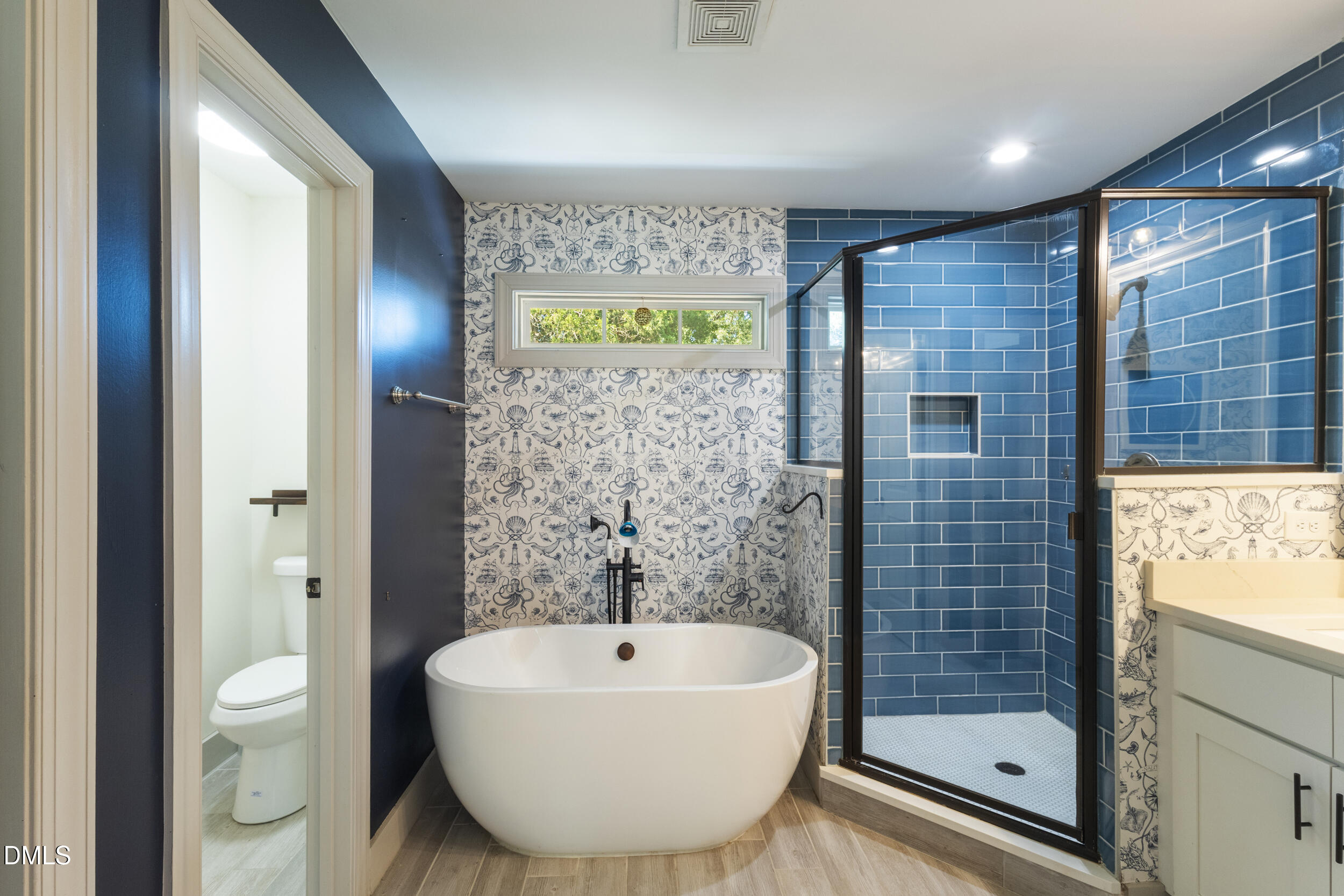 200 Lincoln Court Raleigh, NC 27610 - Photo 23 of 45 a bathroom with a sink a toilet and shower