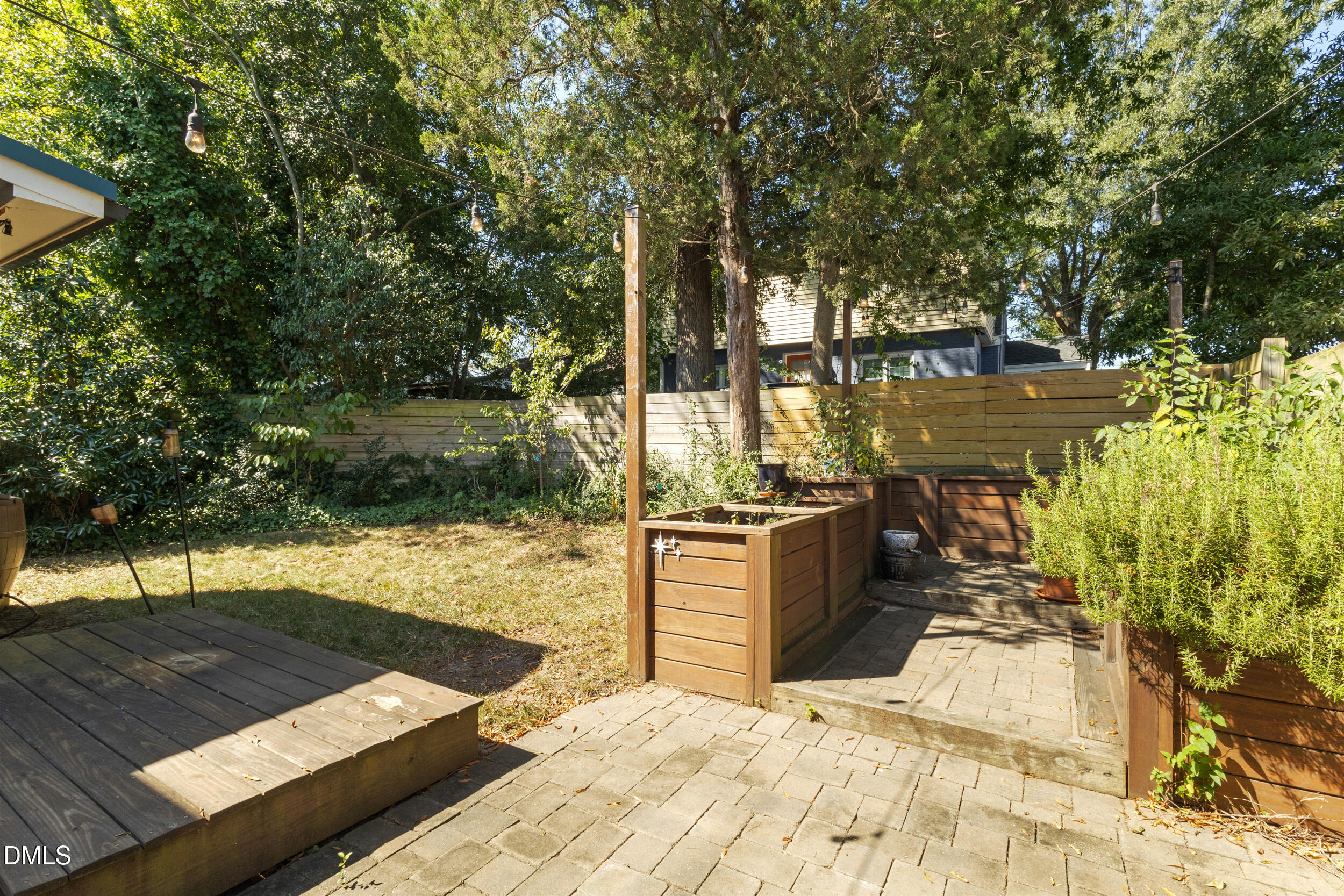 200 Lincoln Court Raleigh, NC 27610 - Photo 27 of 45 a wooden bench sitting next to a lake