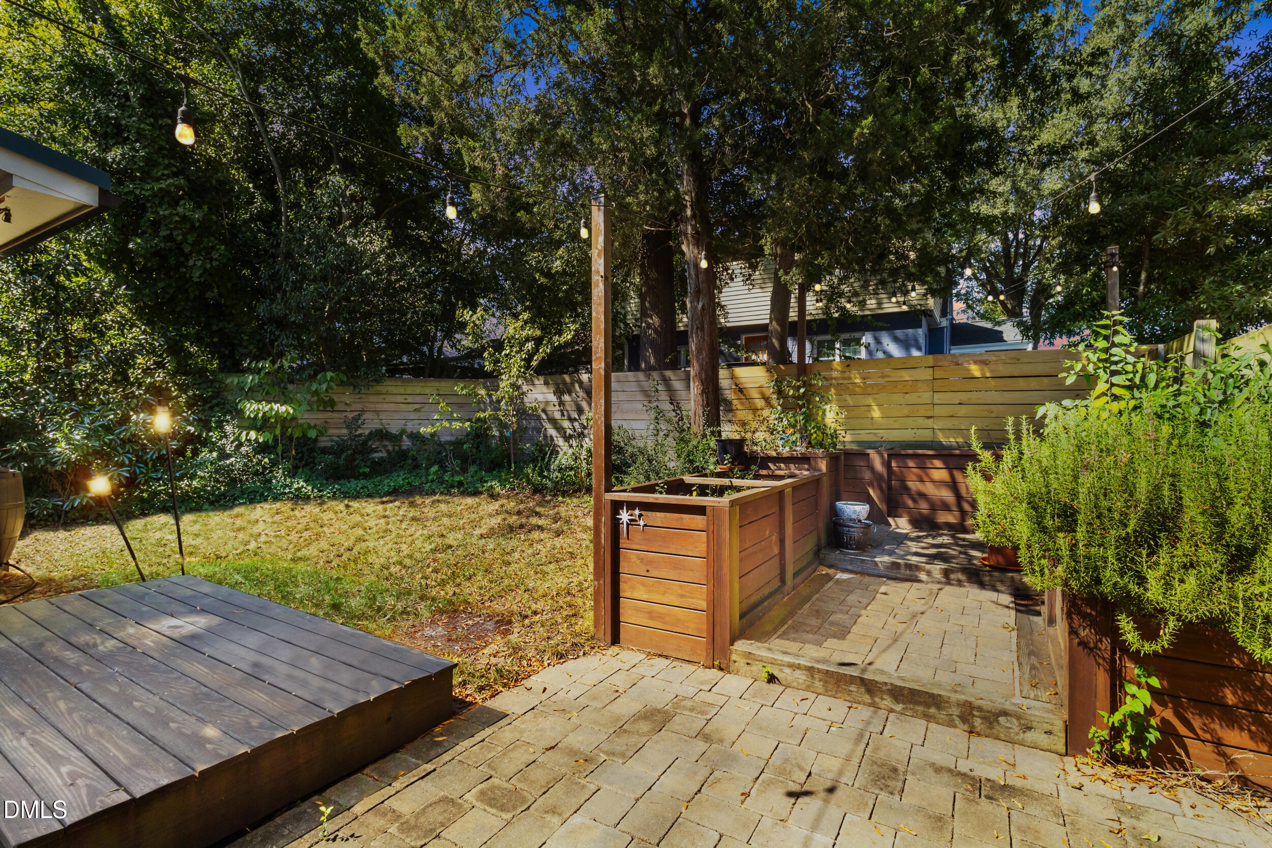 200 Lincoln Court Raleigh, NC 27610 - Photo 33 of 45 a view of a terrace with chairs and wooden fence