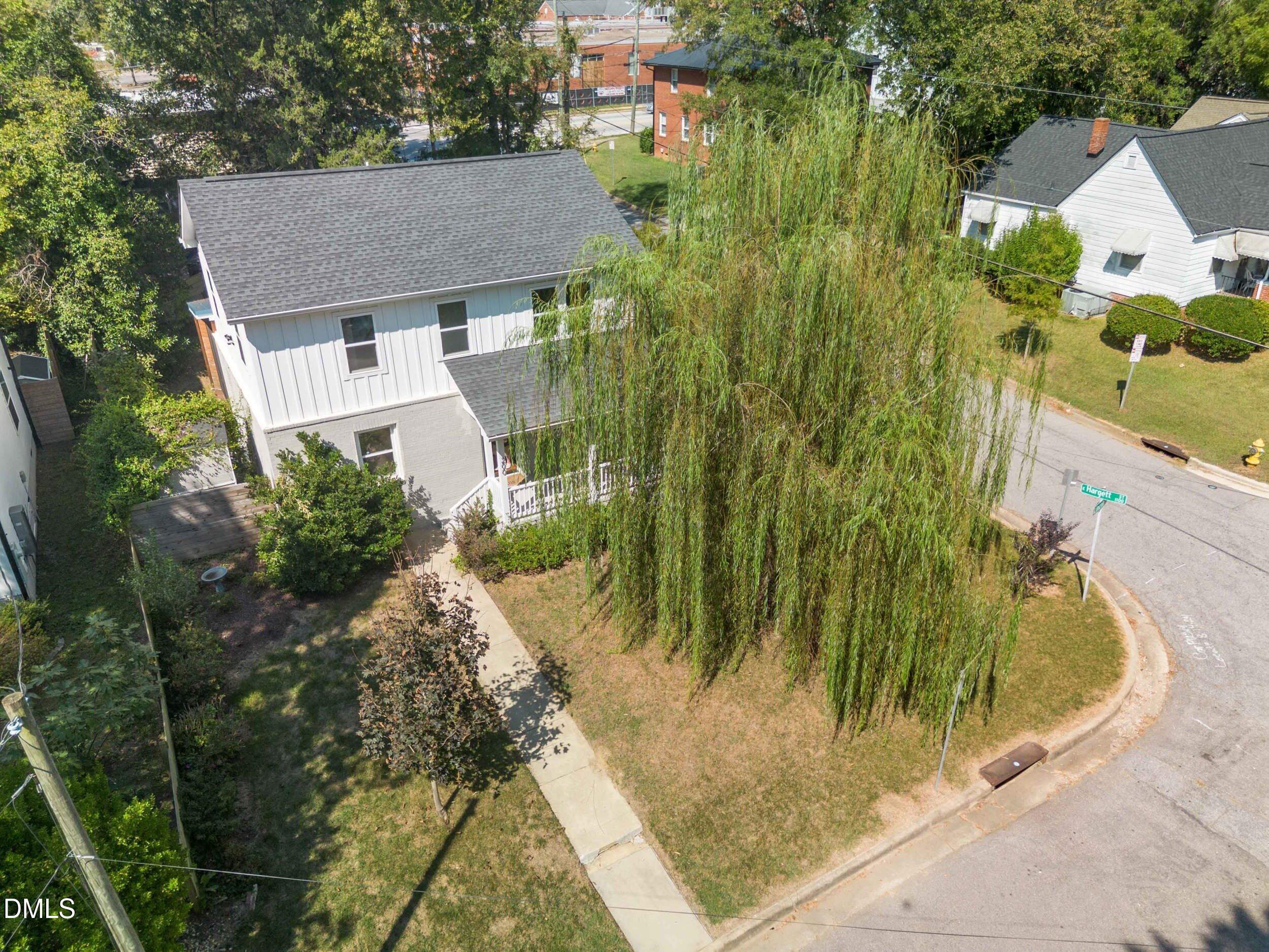 200 Lincoln Court Raleigh, NC 27610 - Photo 34 of 45 a aerial view of a house with a yard and large trees