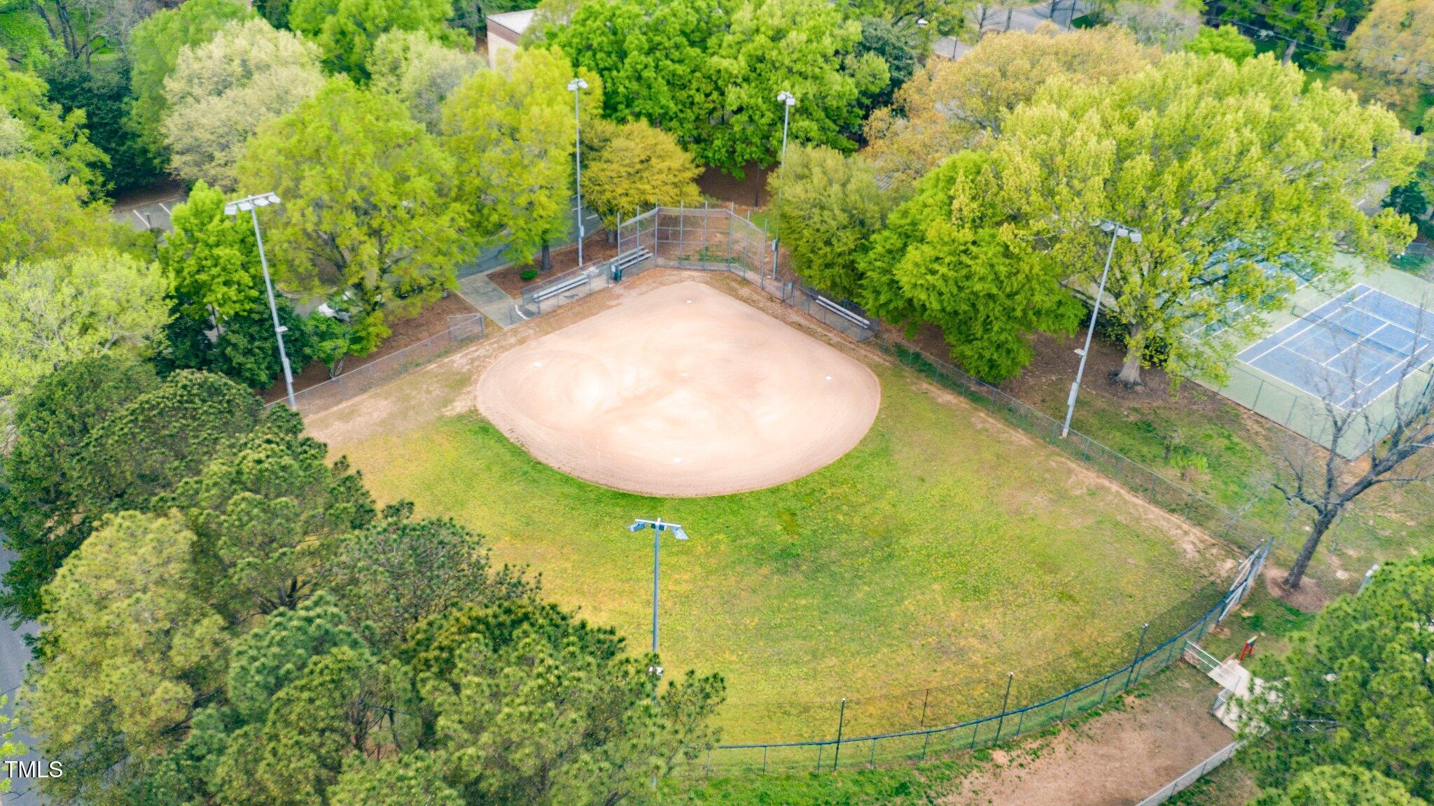 200 Lincoln Court Raleigh, NC 27610 - Photo 41 of 45 a view of a swimming pool with a yard and large trees