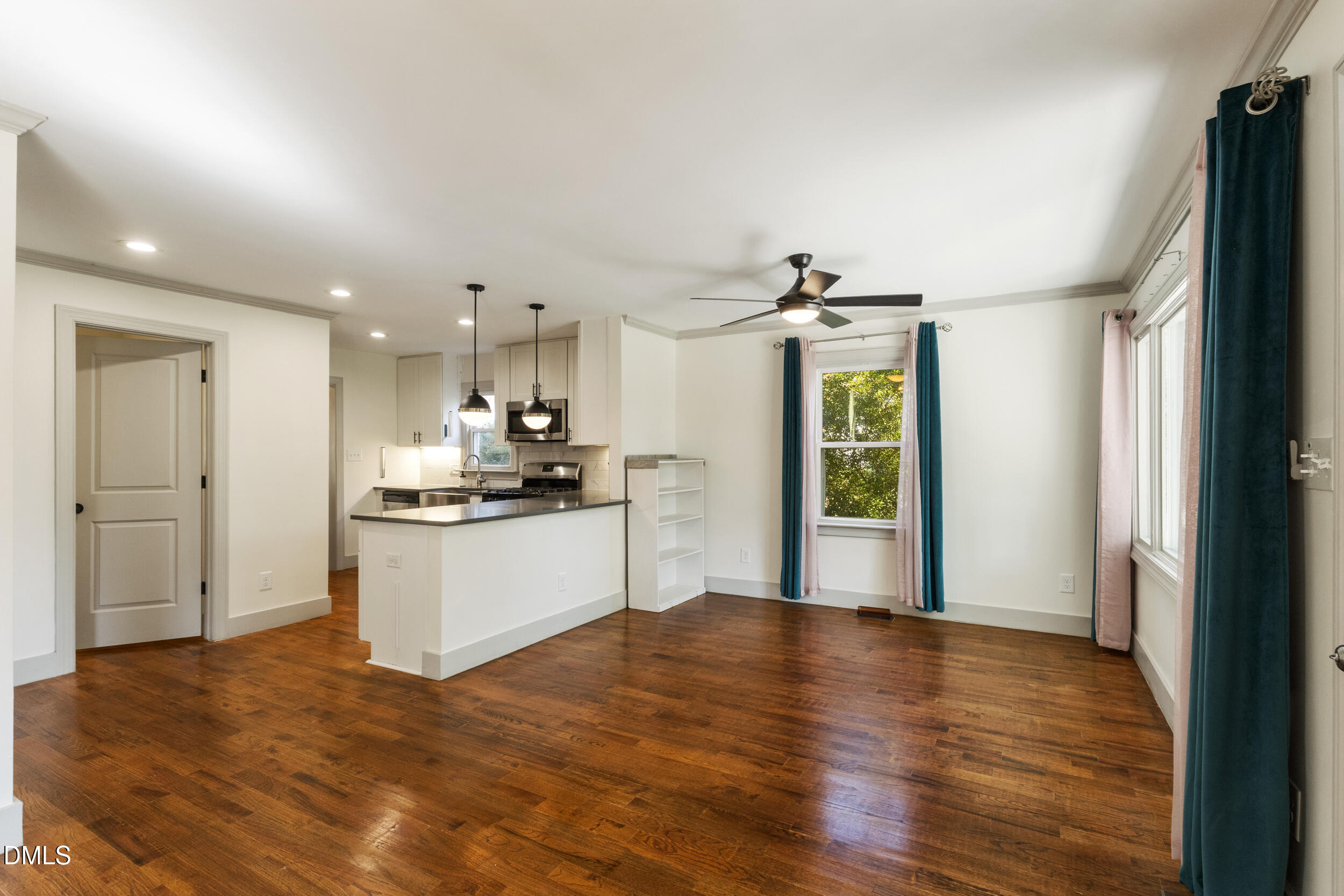 200 Lincoln Court Raleigh, NC 27610 - Photo 6 of 45 a view of a kitchen with kitchen island wooden floors appliances and cabinets