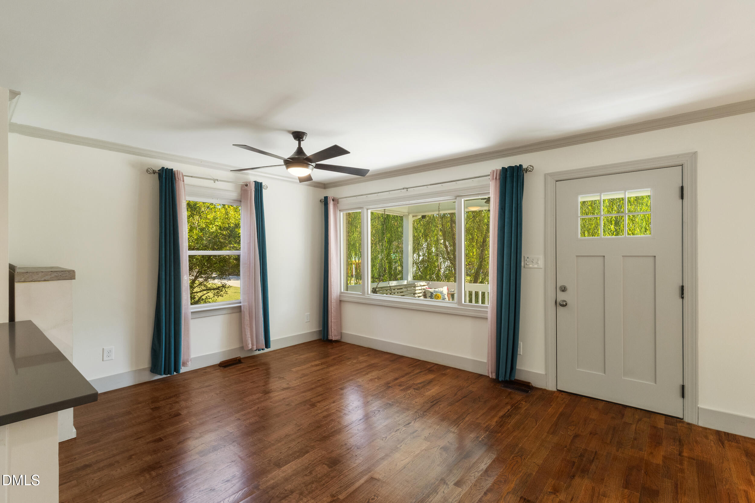 200 Lincoln Court Raleigh, NC 27610 - Photo 7 of 45 a view of an empty room with a window and wooden floor