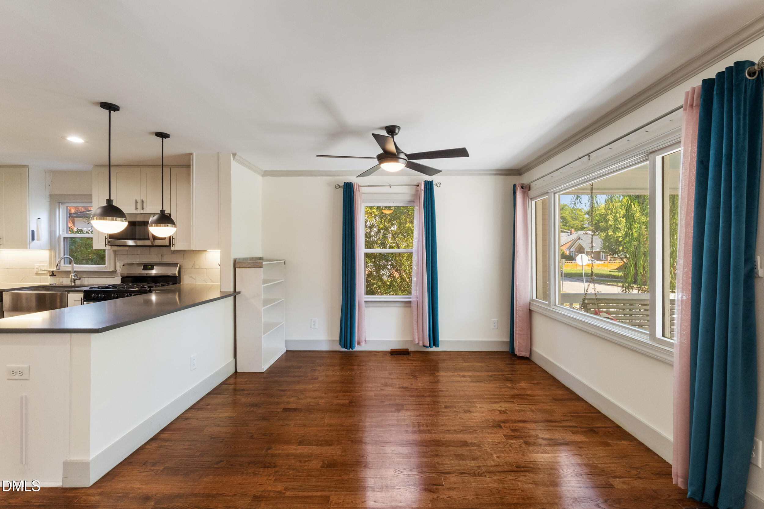 200 Lincoln Court Raleigh, NC 27610 - Photo 8 of 45 a large kitchen with stainless steel appliances granite countertop a stove and a wooden floors
