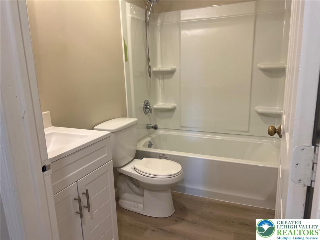 934 Bank Street Emmaus, PA 18049 - Photo 13 of 17 a bathroom with a sink a toilet and shower