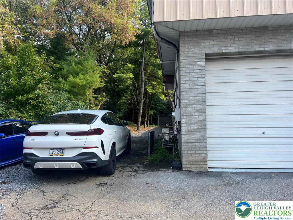 934 Bank Street Emmaus, PA 18049 - Photo 16 of 17 a white car parked in front of a house