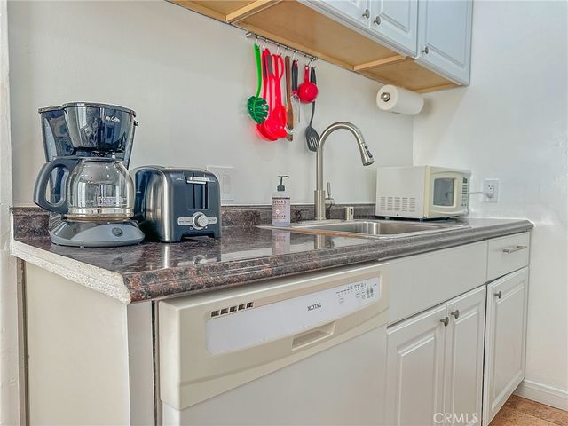 a kitchen with a sink and a stove