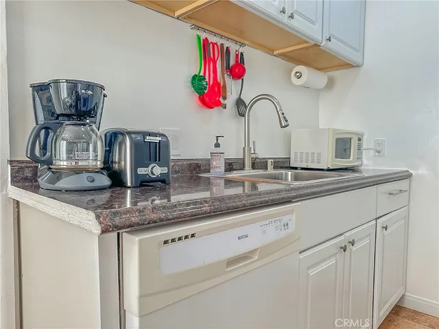 a kitchen with a sink and a stove