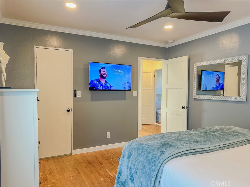 33922 Malaga Drive Dana Point, CA 92629 - Photo 17 of 22 a bedroom with bed and wall painting