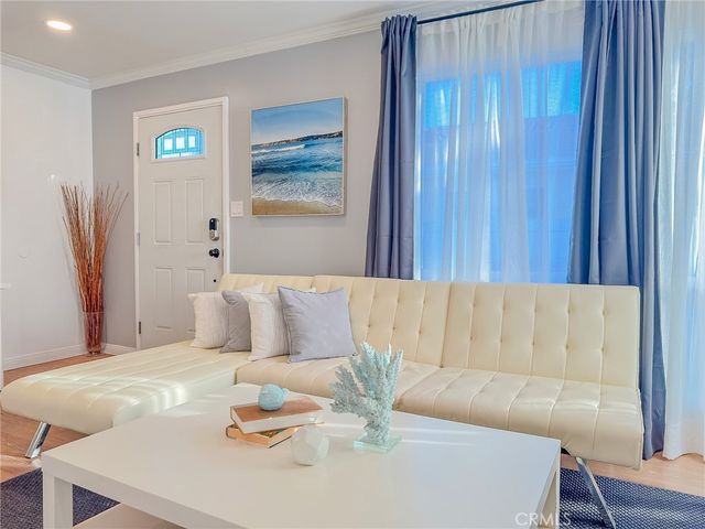 a living room with furniture and a table