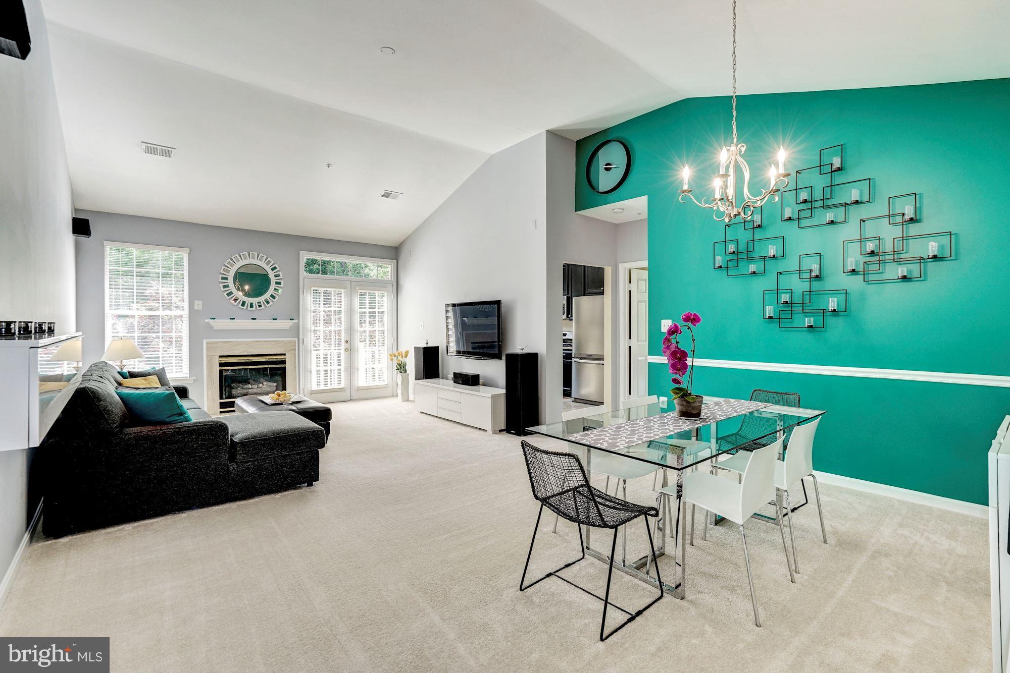 11408 Gate Hill Place, Unit 116 Reston, VA 20194 - Photo 2 of 28 a living room with furniture fireplace and window