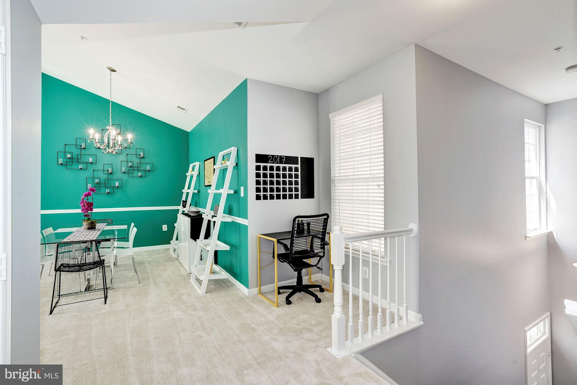 11408 Gate Hill Place, Unit 116 Reston, VA 20194 - Photo 16 of 28 a view of a livingroom with furniture and a floor to ceiling window