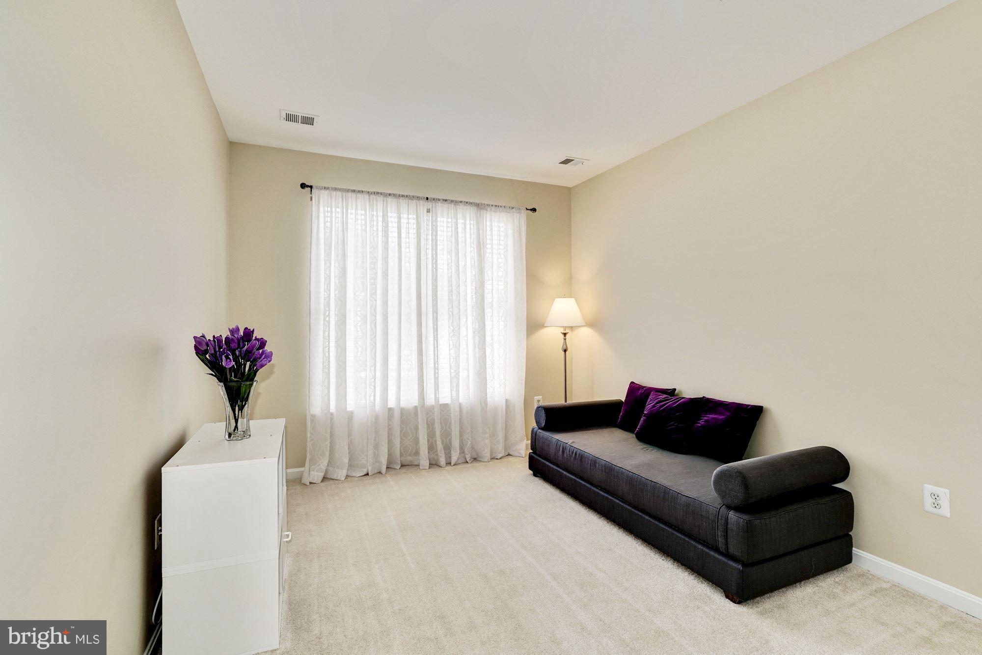 11408 Gate Hill Place, Unit 116 Reston, VA 20194 - Photo 17 of 28 a living room with furniture and a potted plant