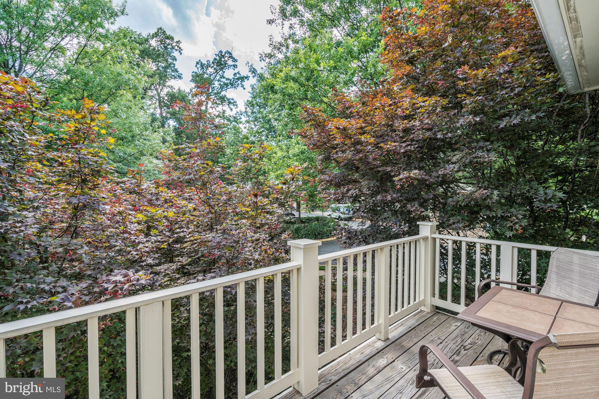 11408 Gate Hill Place, Unit 116 Reston, VA 20194 - Photo 21 of 28 a view of a wooden deck with a bench