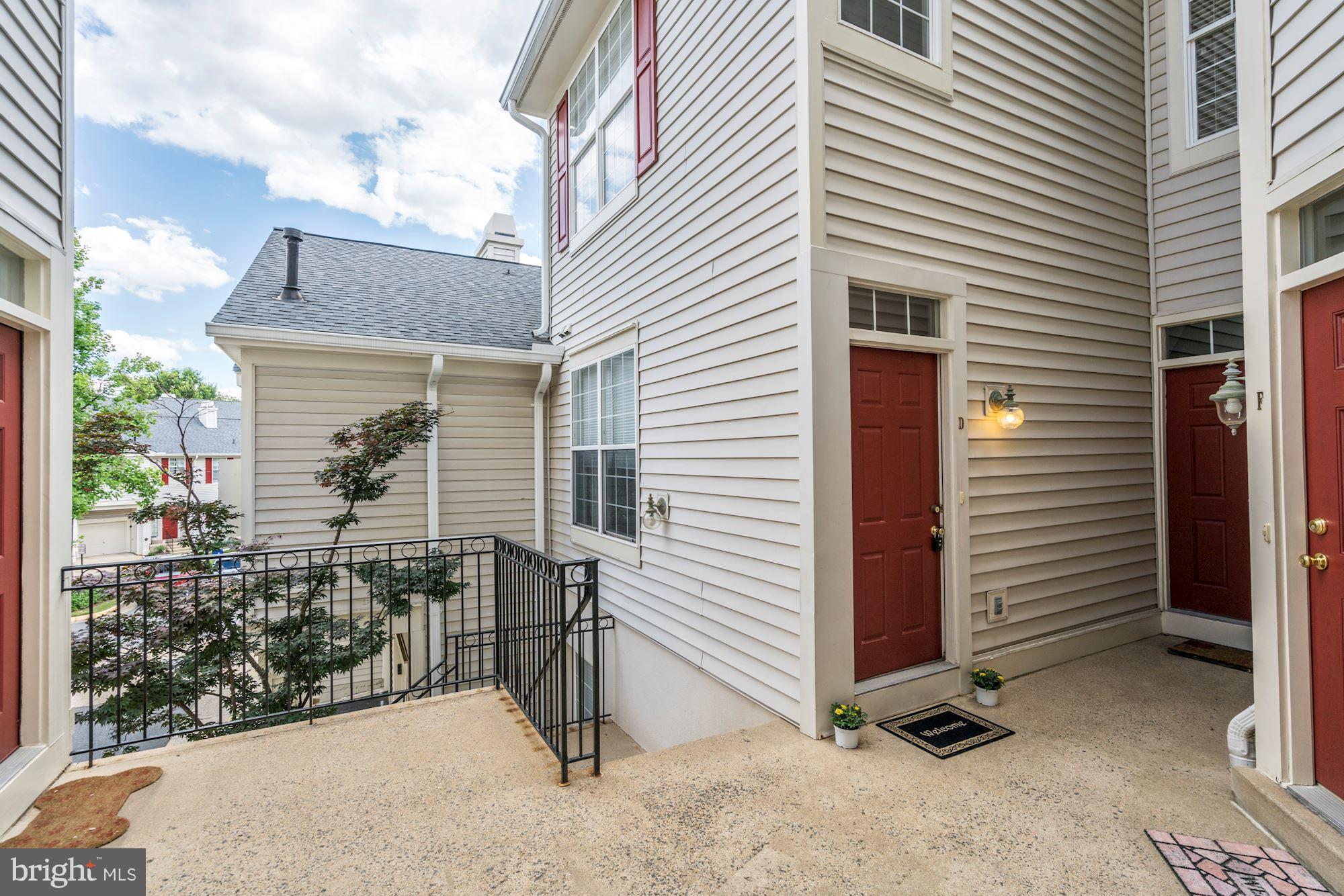 11408 Gate Hill Place, Unit 116 Reston, VA 20194 - Photo 24 of 28 a view of a house with backyard