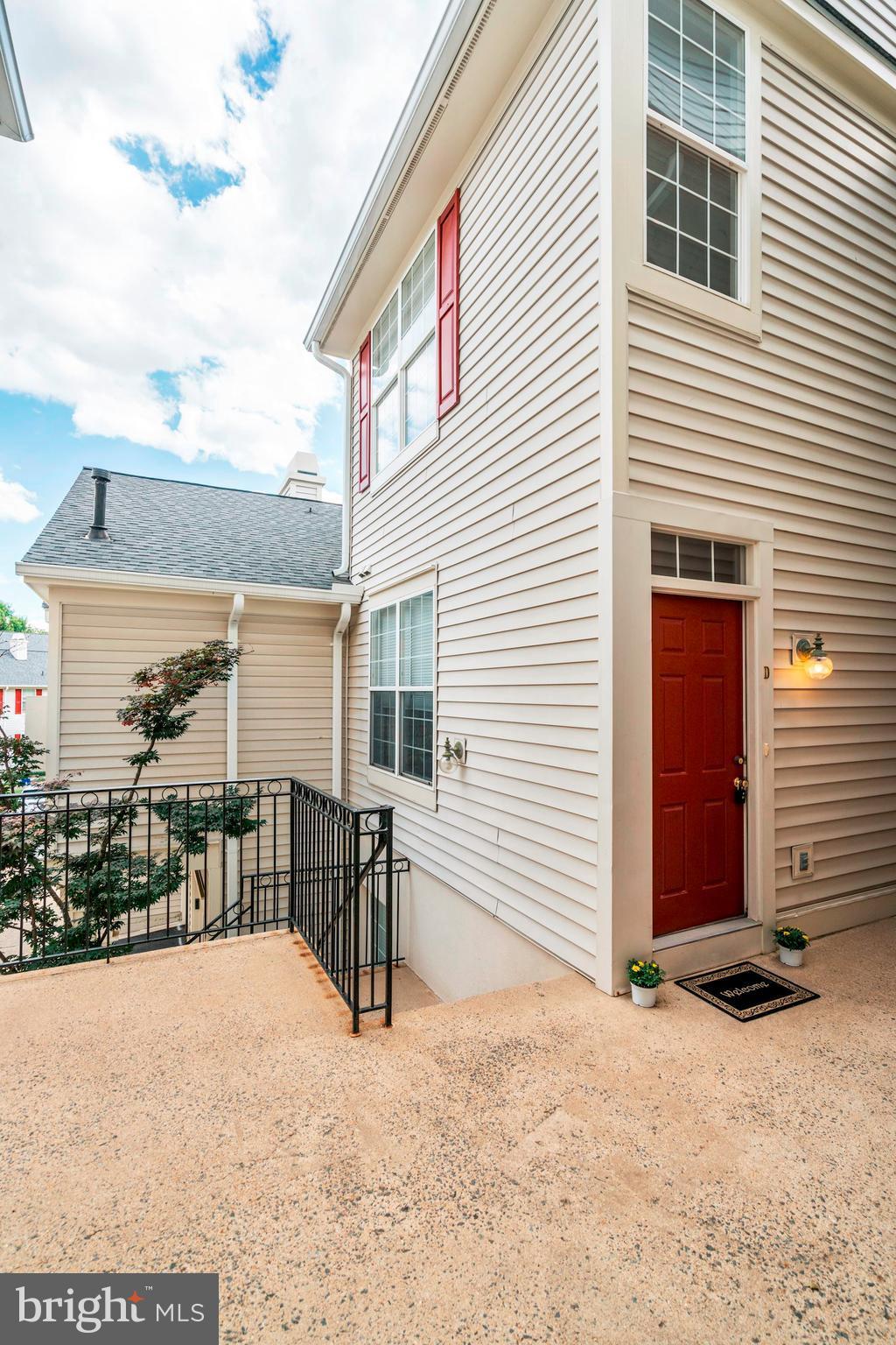 11408 Gate Hill Place, Unit 116 Reston, VA 20194 - Photo 25 of 28 a view of a house with a patio