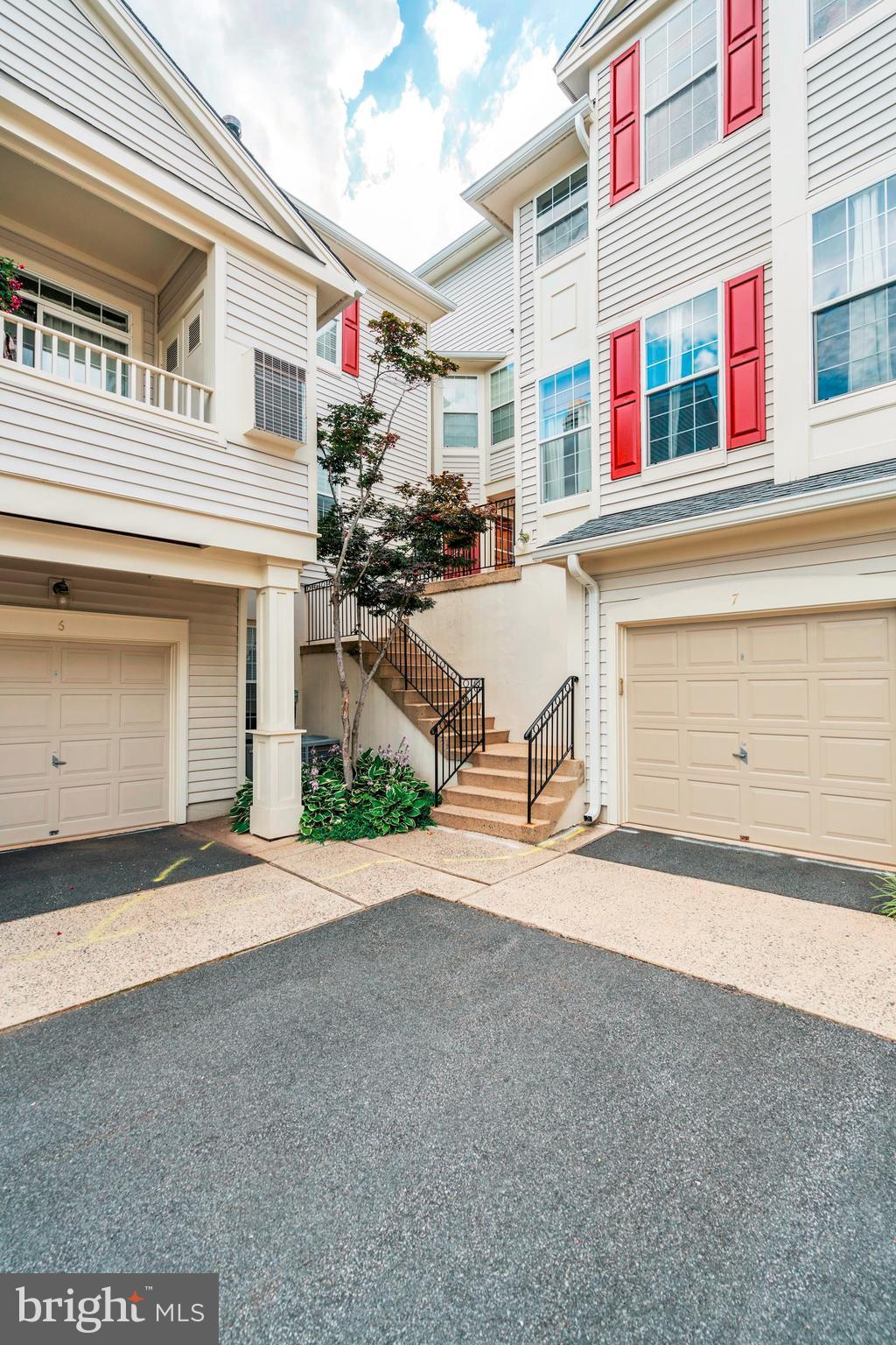 11408 Gate Hill Place, Unit 116 Reston, VA 20194 - Photo 27 of 28 a view of a building with many windows