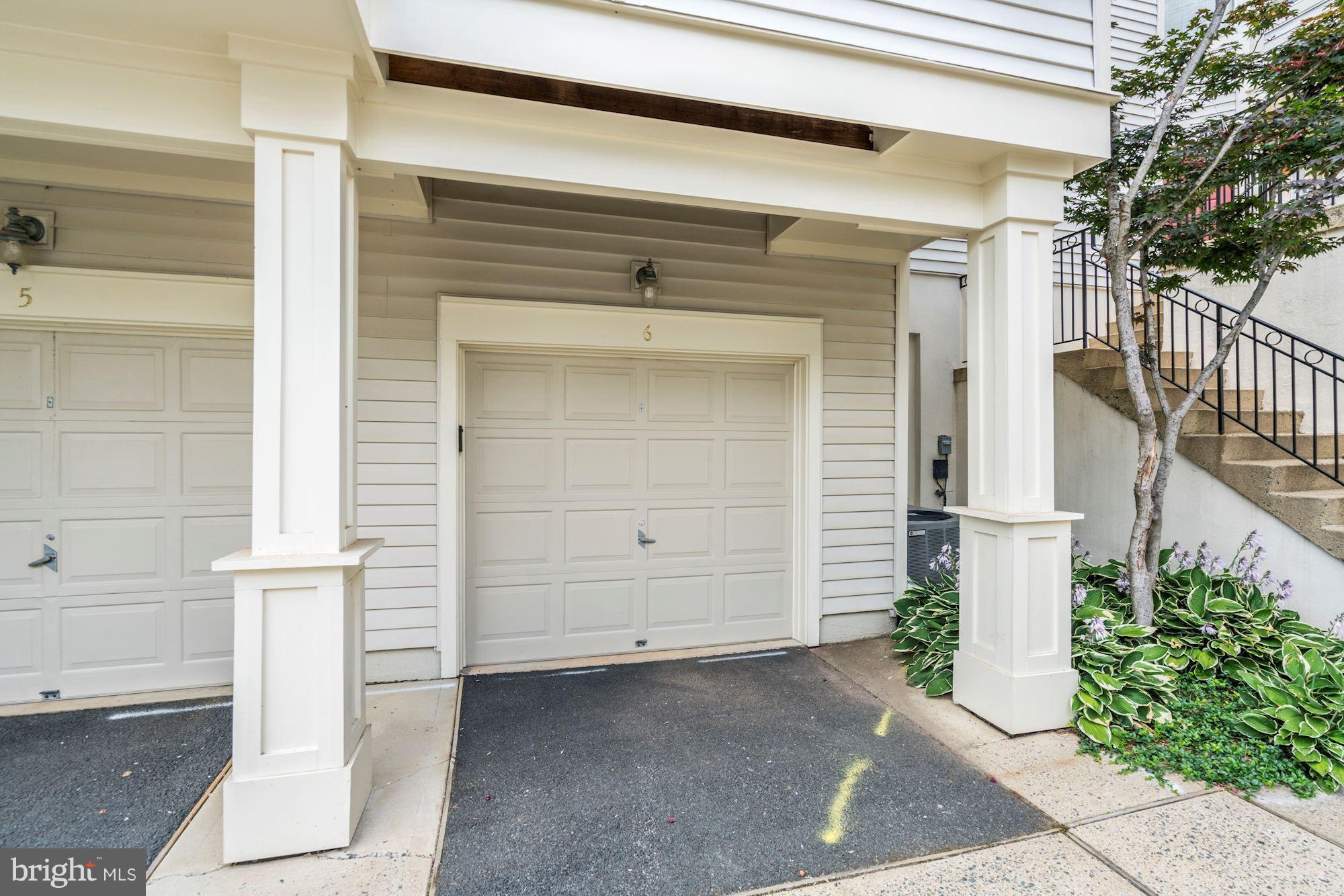 11408 Gate Hill Place, Unit 116 Reston, VA 20194 - Photo 28 of 28 a front view of a house with garage