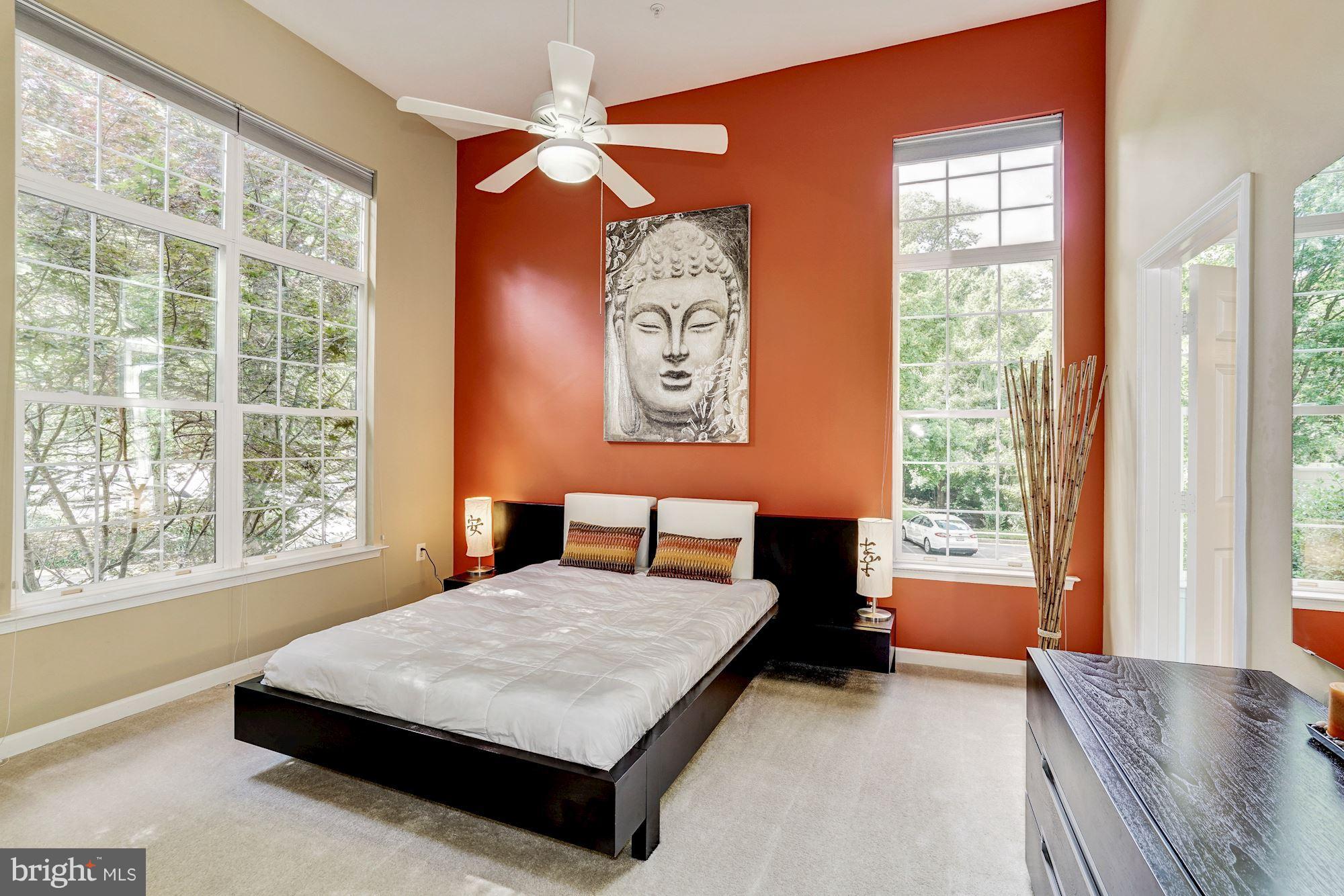 11408 Gate Hill Place, Unit 116 Reston, VA 20194 - Photo 9 of 28 a bedroom with a bed dresser and a window