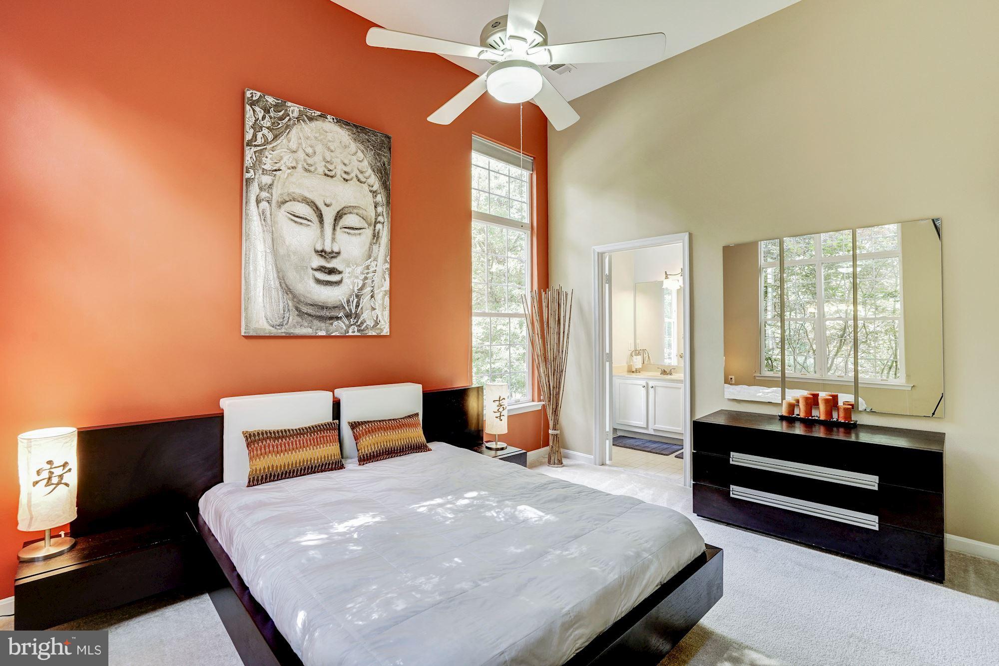 11408 Gate Hill Place, Unit 116 Reston, VA 20194 - Photo 10 of 28 a bedroom with a bed and a window