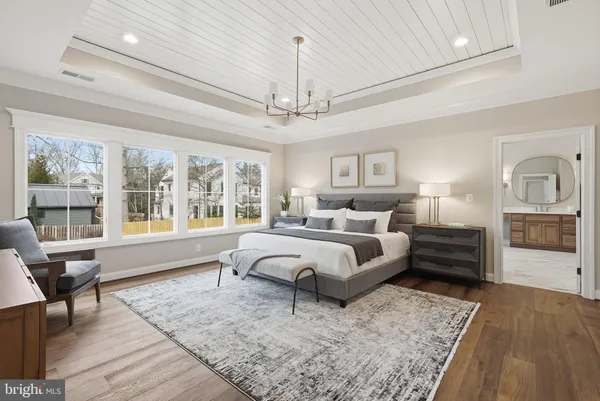 a spacious bedroom with a large bed and a window