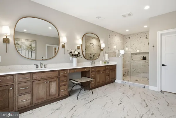 a view of bathroom with dual sinks