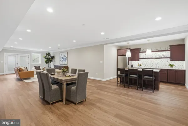 a view of a dining room with furniture and wooden floor